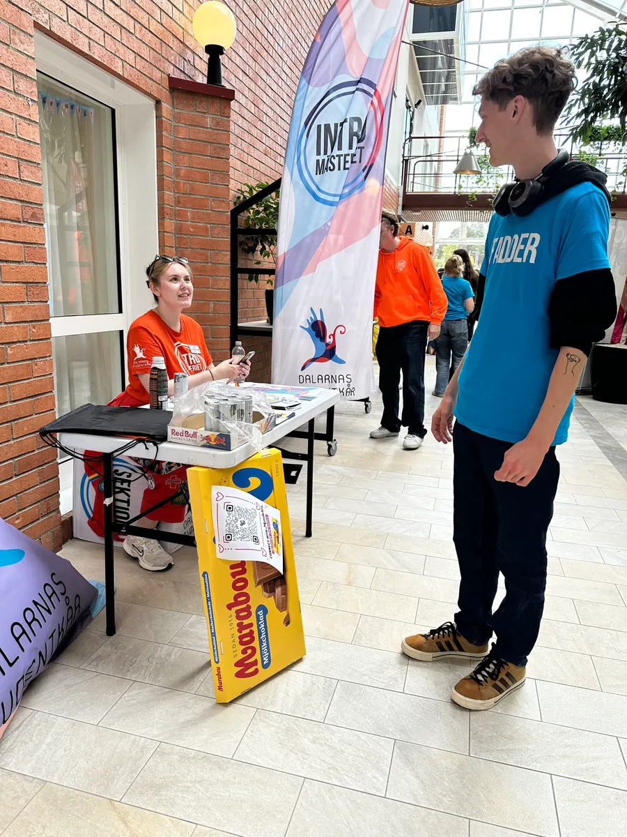 Students staffing a stand at a campus fair.